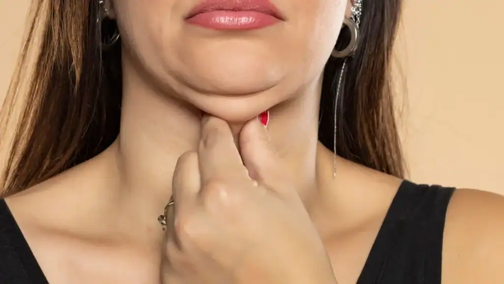 An image of a woman with double chin, sad, worried : Non Surgical Double Chin Removal Treatment in Littlehampton, UK